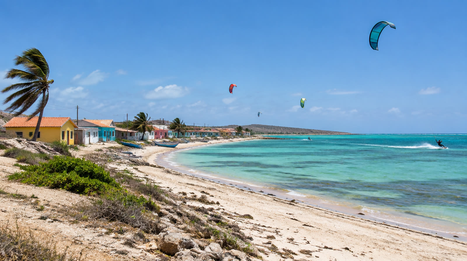 Kitesurfers over a windswept beach at Adicora, Falcón State